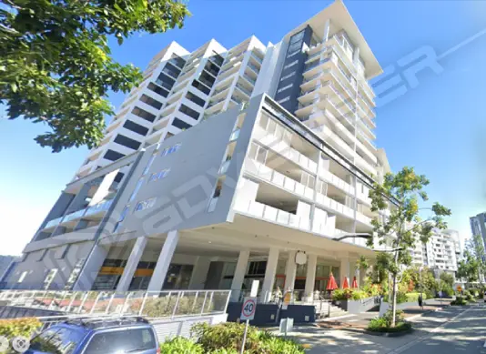 Modern apartment building with greenery.